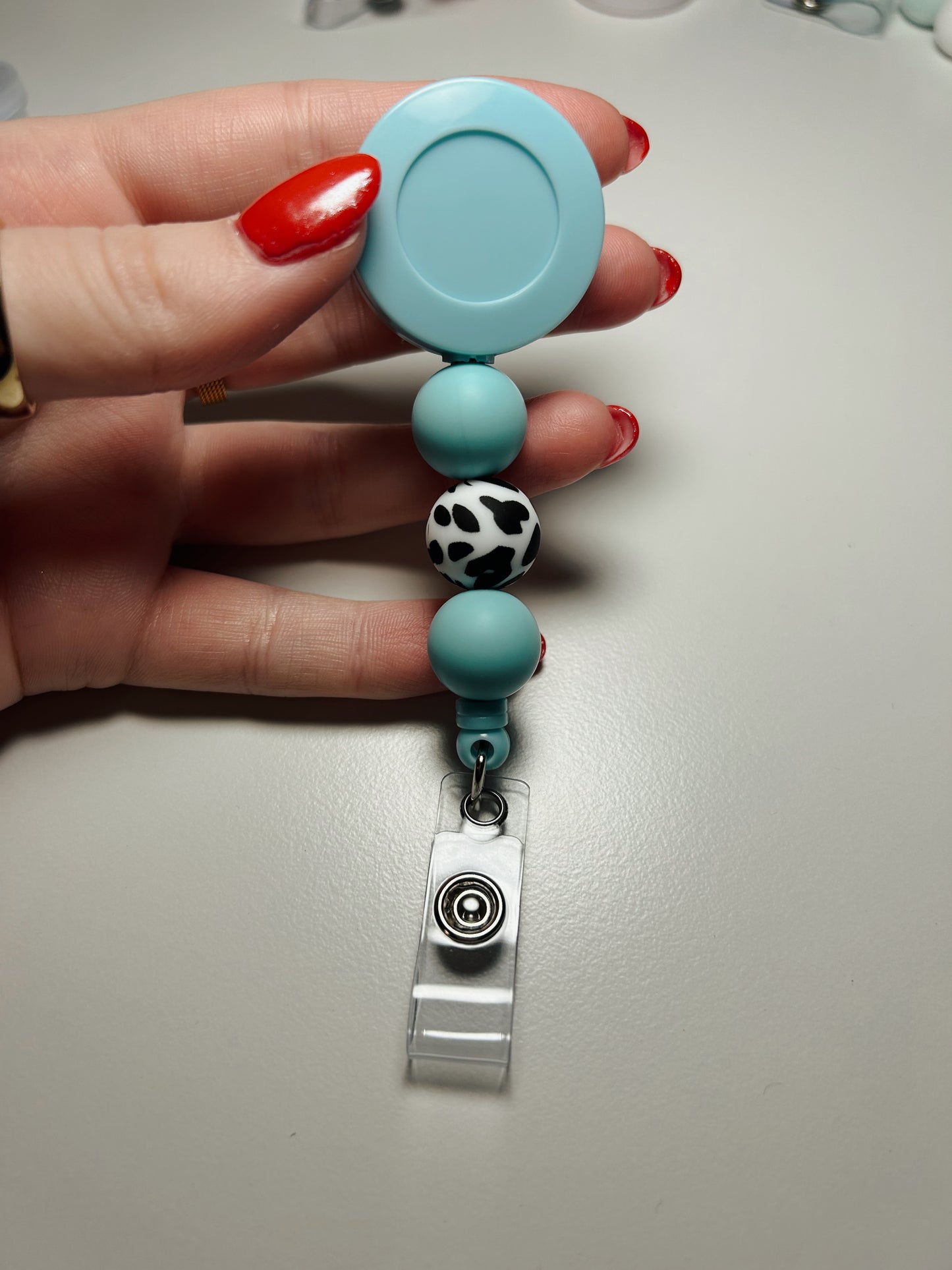 light blue badge reel