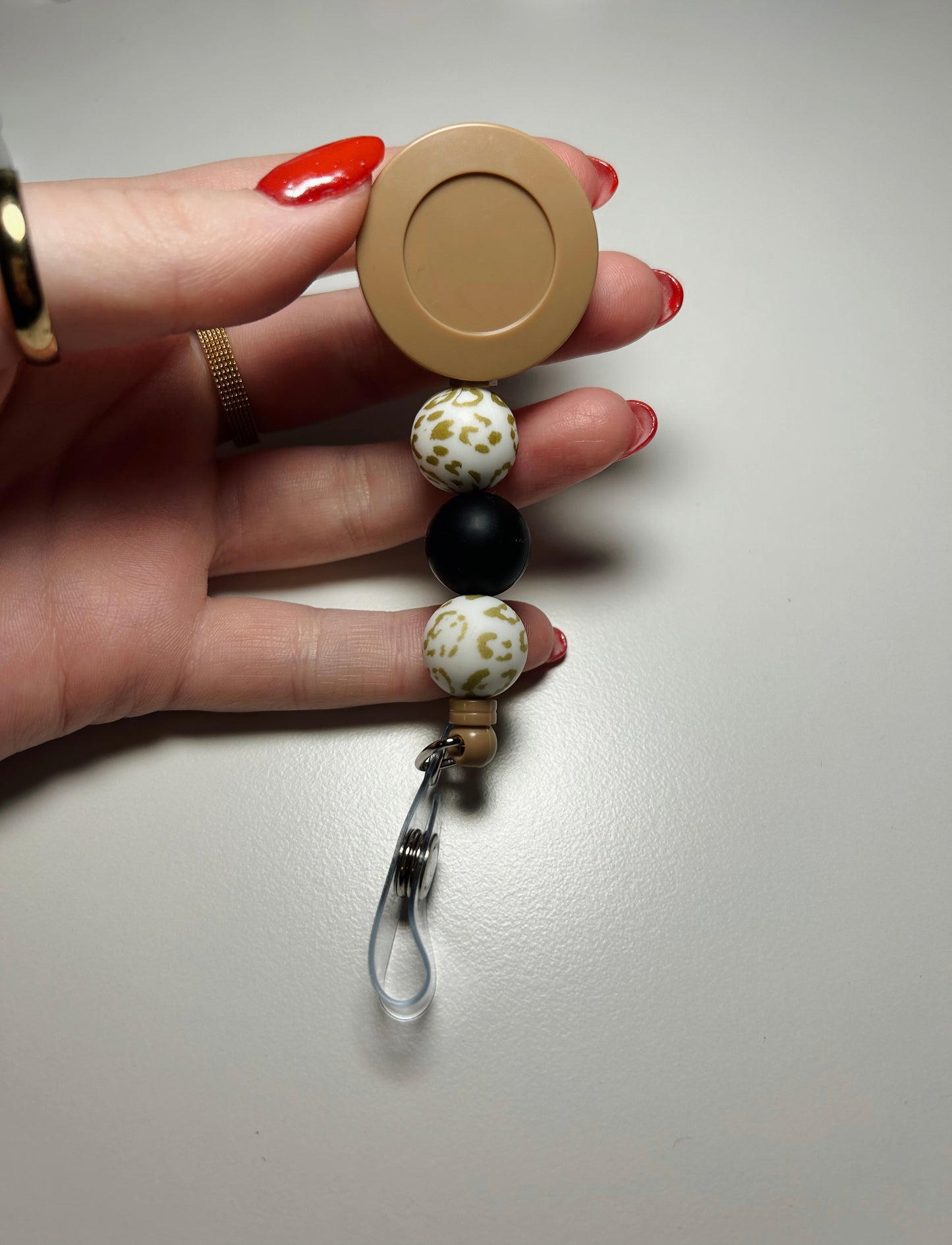 beige badge reel