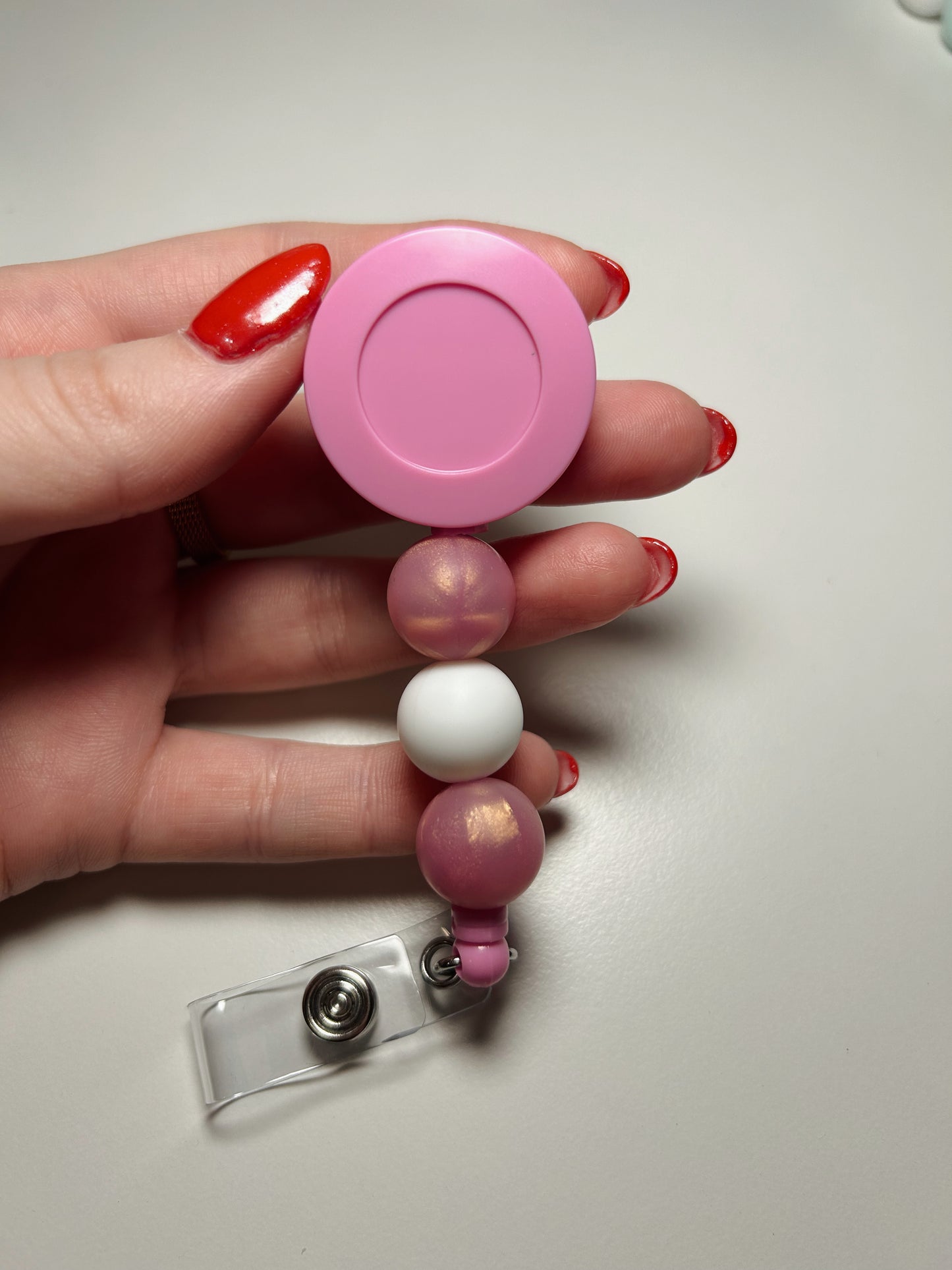 pink badge reel