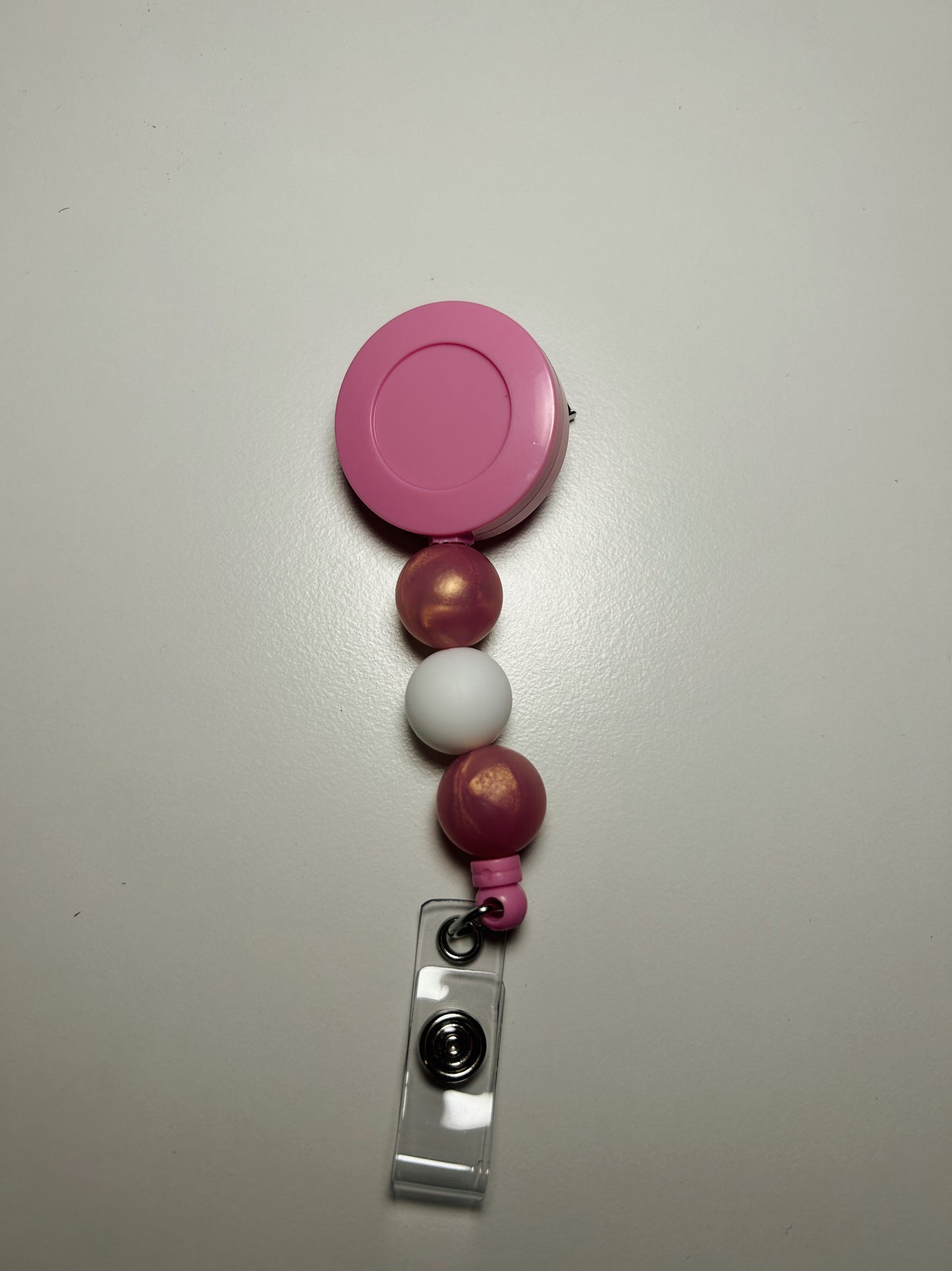 pink badge reel